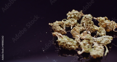 Close up of Cannabis Rotating on Black Background.