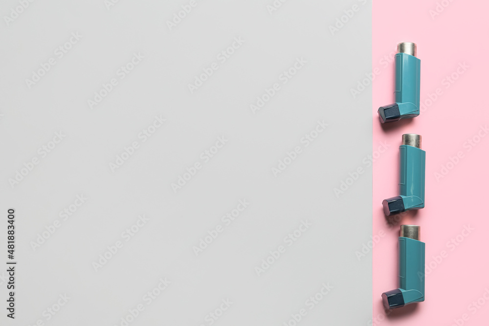 Fototapeta premium Asthma inhalers on color background