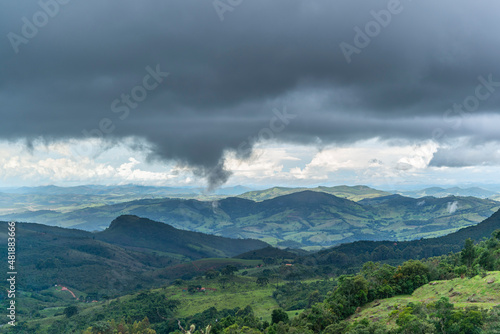 Fototapeta Naklejka Na Ścianę i Meble -  Rain clouds in the countryside in Aiuruoca, Minas Gerais, Brazil on January 05, 2020.