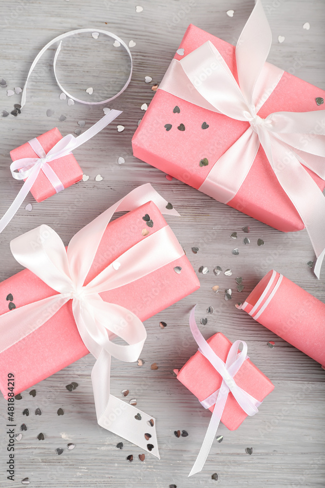 Gifts for Valentine's Day on grey wooden background Gifts for Valentine's Day on grey wooden background