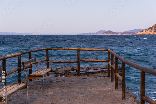 Coast and sea near Sant Andrea on the island of Elba in Italy with blue sky in summer at dusk