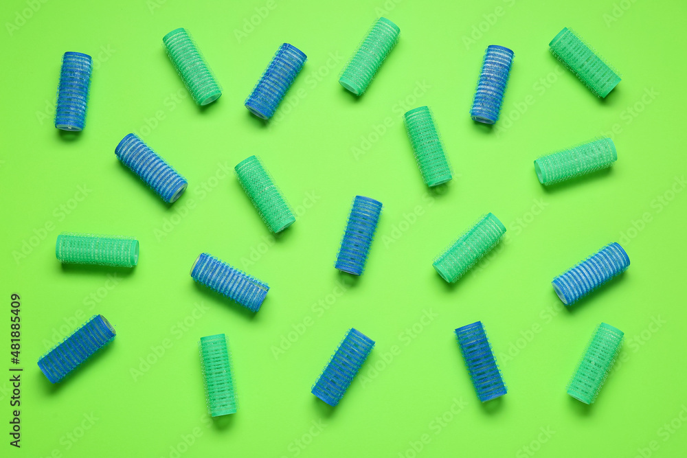 Set of hair curlers on green background Set of hair curlers on green background