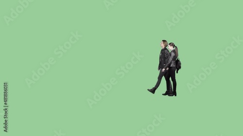 A couple in leather jackets walk together holding hands. Isolated on transparent background