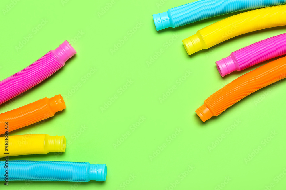 Pop Tubes on green background Pop Tubes on green background