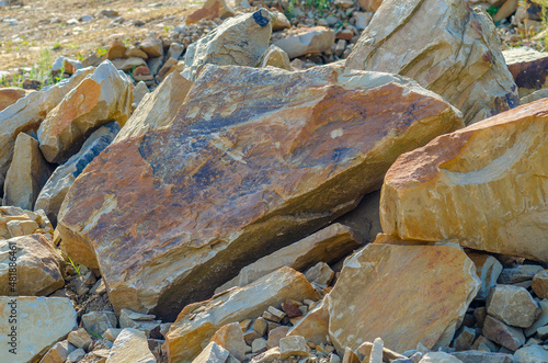 Pile of natural stone for background texture. Stone mining.