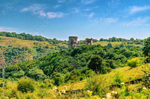 View of old ruined fortress on hill. Mystical landscape. © romankrykh
