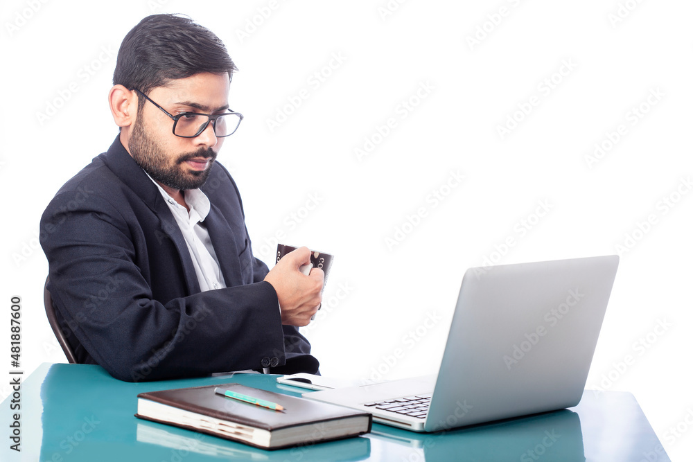 businessman drinking coffee and looking at laptop screen in isolated background businessman drinking coffee and looking at laptop screen in isolated background
