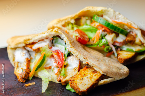 Wallpaper Mural Mediterranean style pitta prepared with spicy chicken, cucumber, tomato, salad and mayo sauce Torontodigital.ca