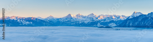 winter landscape with swiss mountains and fog
