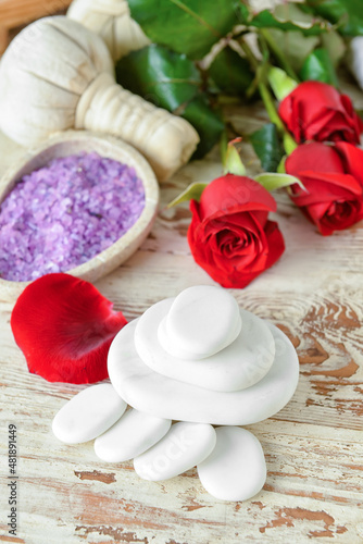 Spa stones on white wooden background. Valentine s Day celebration