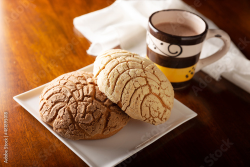 Conchas. Mexican sweet bread roll with seashell-like appearance, Usually eaten with coffee or hot chocolate at breakfast or as an afternoon snack. photo