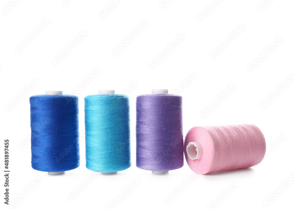 Different sewing thread spools on white background Different sewing thread spools on white background