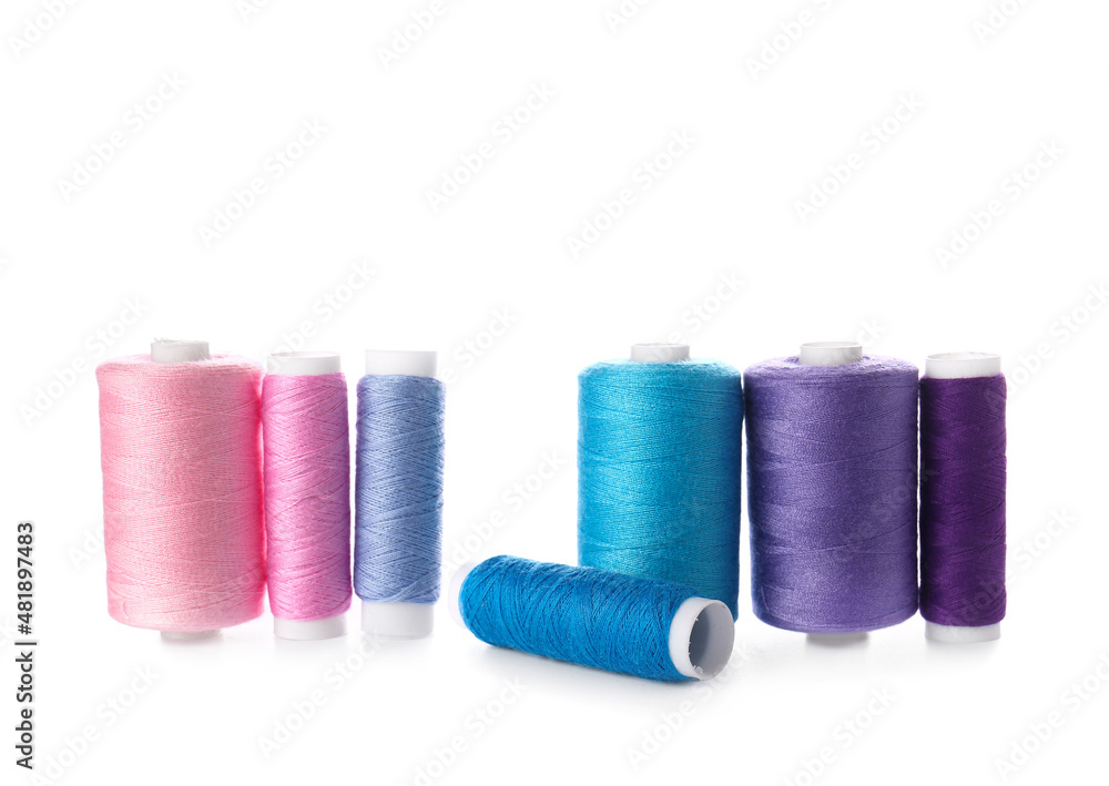 Different sewing thread spools on white background Different sewing thread spools on white background