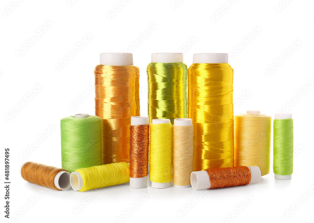 Different sewing thread spools on white background Different sewing thread spools on white background