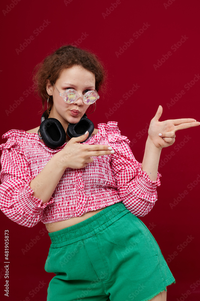 Obraz premium cheerful girl with headphones and glasses music entertainment unaltered