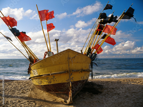 Fishing boat on the beach, Rewal, Baltic sea, Poland photo