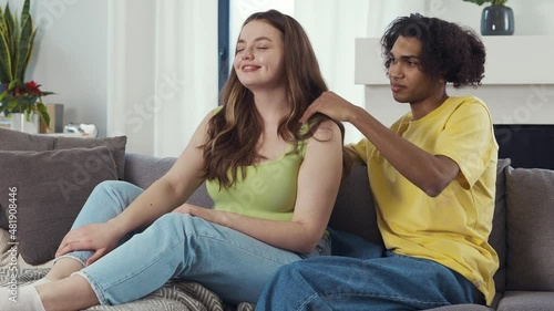 Modern multiethnic unstereotyped couple lifestyle moments at home. Not stereotyped boyfriend and girlfriend living together. True love concepts