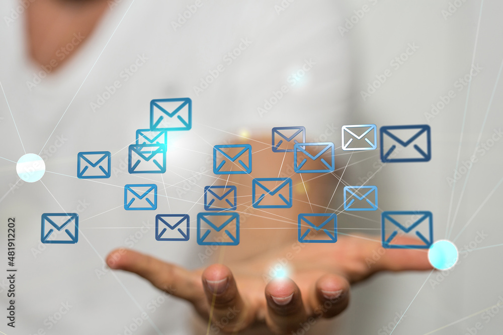 Hand holding using mobile phone with email icon on screen. Concept of business communication Hand holding using mobile phone with email icon on screen. Concept of business communication