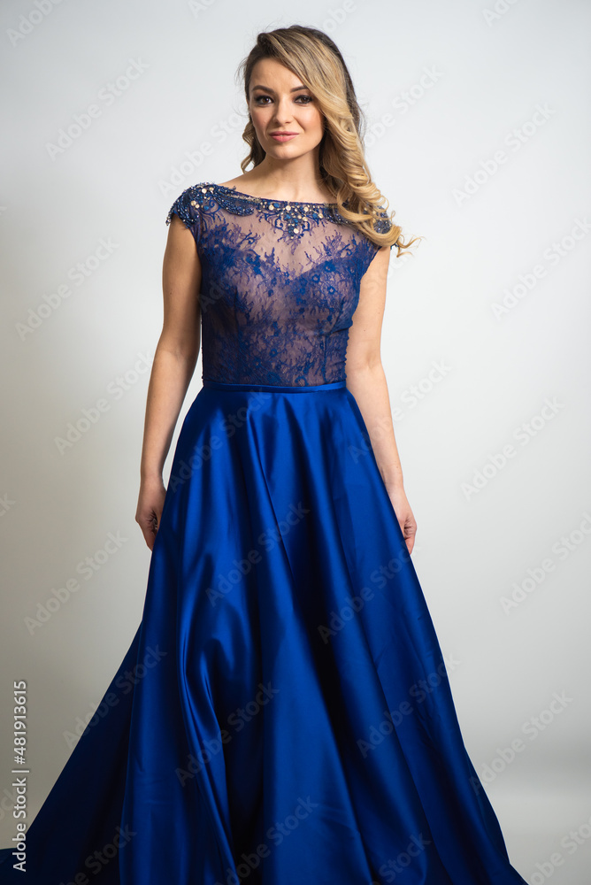 beautiful young blond woman in dress on white studio background beautiful young blond woman in dress on white studio background