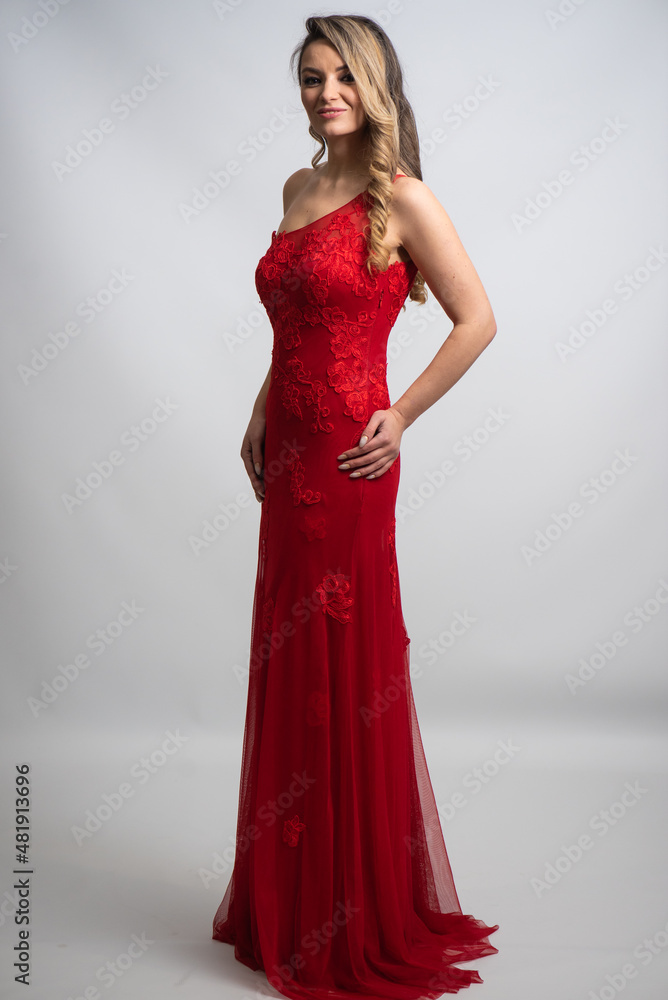 beautiful young blond woman in dress on white studio background beautiful young blond woman in dress on white studio background