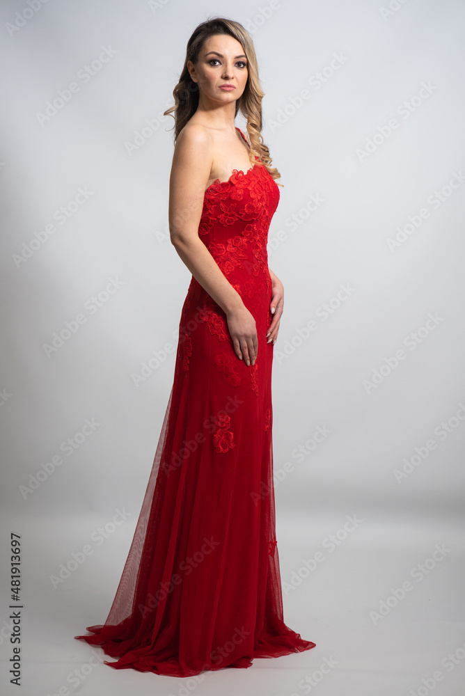 beautiful young blond woman in dress on white studio background beautiful young blond woman in dress on white studio background