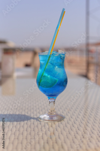 glass of Iced blue hawaii soda on table Blue Lagoon Cocktail