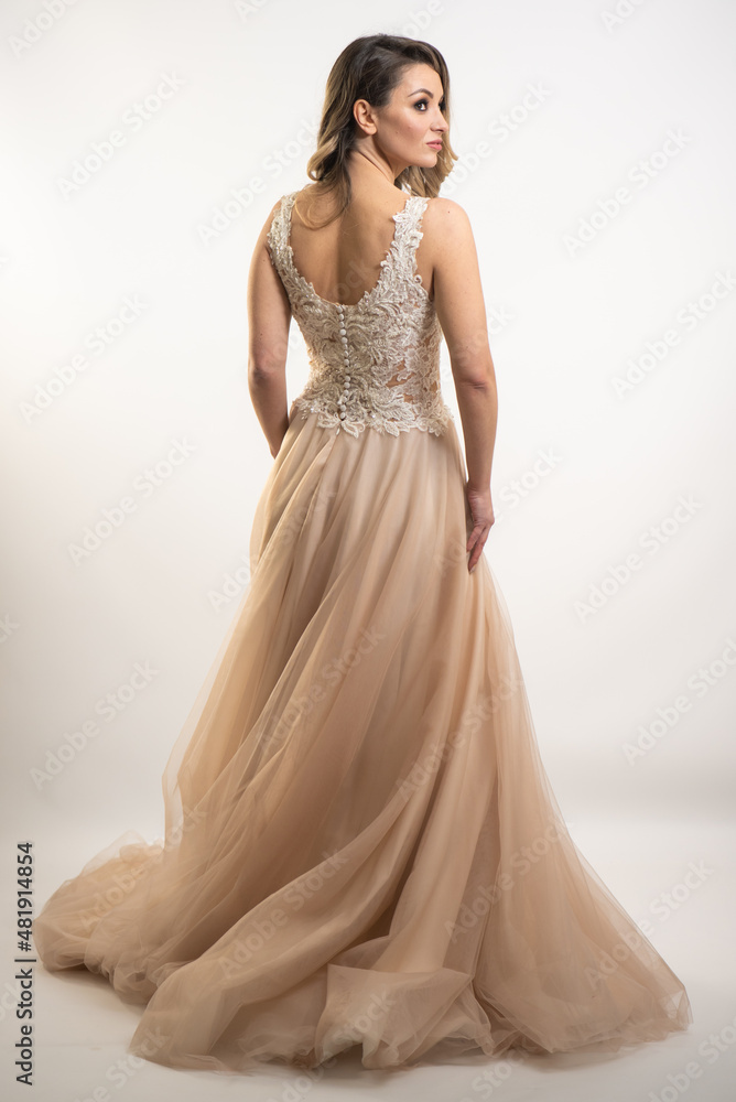 beautiful young blond woman in dress on white studio background beautiful young blond woman in dress on white studio background