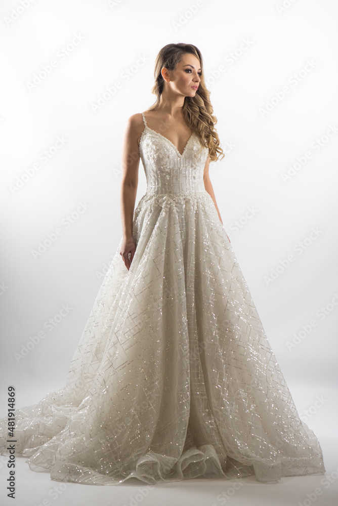 beautiful young blond woman in dress on white studio background beautiful young blond woman in dress on white studio background