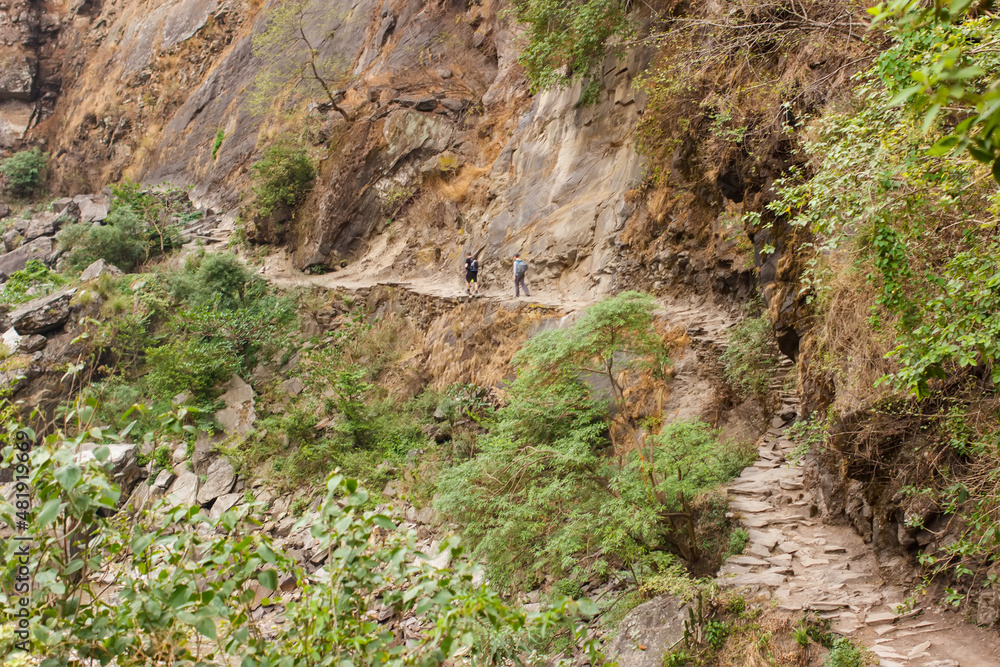 Trail along the steep wall of the gorge in the Himalayas in the Manaslu region