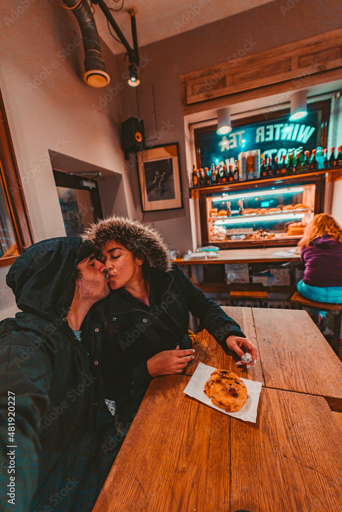 Cute Couple Kissing in Bakery with Pastry
