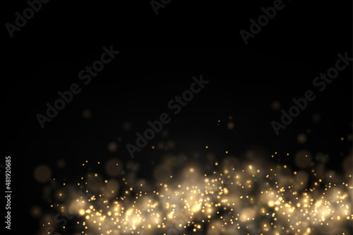 Sparkling golden magic dust particles bokeh light.