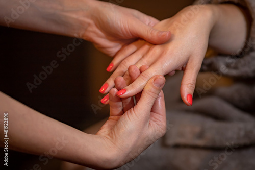 Close-up massage of the girl's hands. The concept of body care. High quality photo