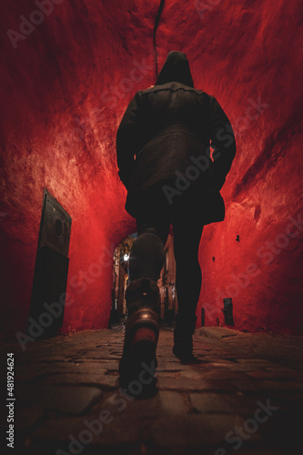 Photography Girl in Black Walking Through Moody Domed Red Alley Hallway