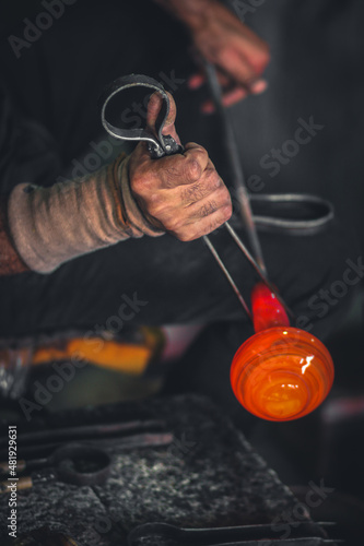 Glass production blowing in traditional industry glass factory in Hebron, Palestine photo