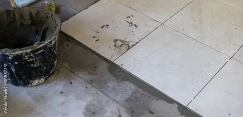 Close-up Installing tiles floor in construction work