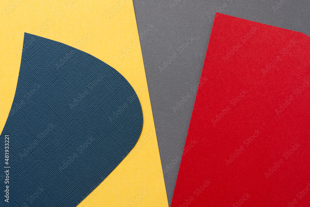 abstract paper background in blue, yellow, gray, and red abstract paper background in blue, yellow, gray, and red