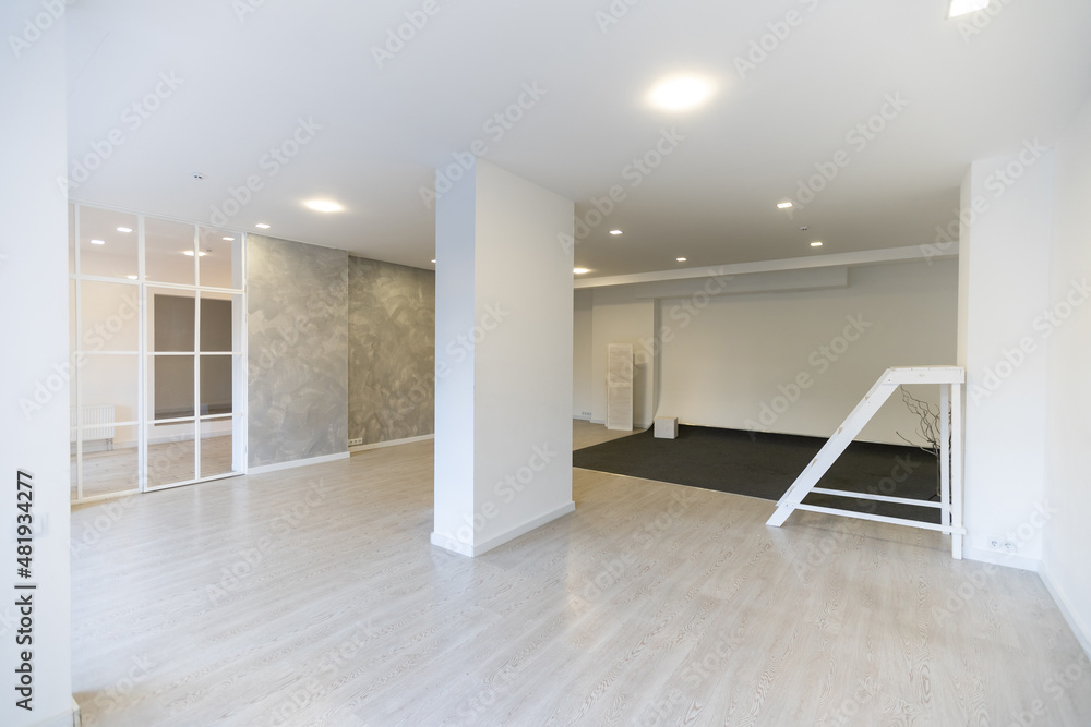Fototapeta premium Bright empty office interior, white large office space.