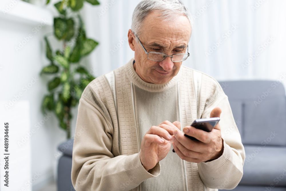 Close up of man hands using smartphone over white table Close up of man hands using smartphone over white table