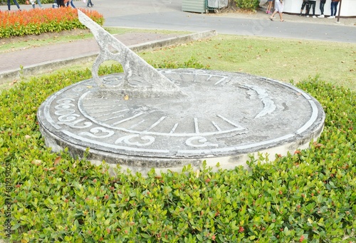 Made of cement solar clock in garden