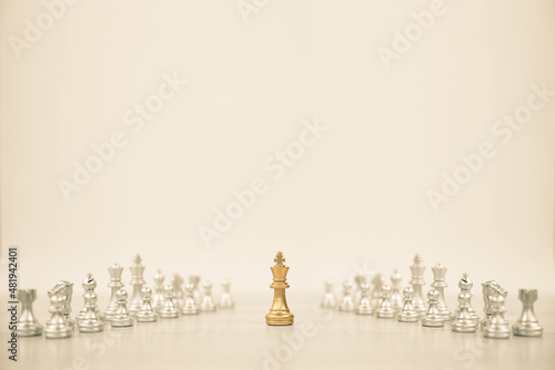 Close-up king chess standing first in line teamwork on chess board concepts challenge or battle fighting of business team and leadership strategy and organization risk management or team player.