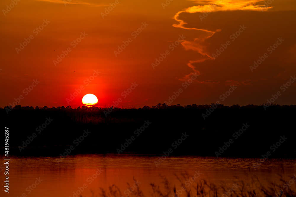 Fototapeta premium sunset or evening time over lake water.