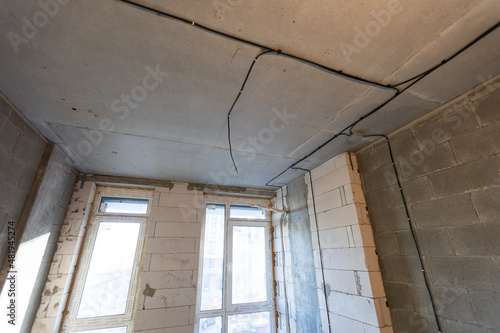 Working process of installing metal frames for plasterboard -drywall - for making gypsum walls in apartment is under construction, remodeling, renovation, extension, restoration and reconstruction