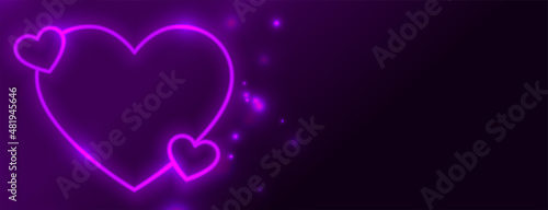 glowing neon heart on purple banner design