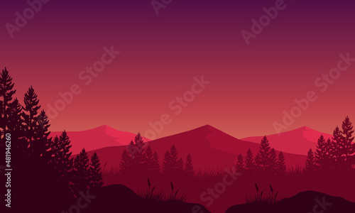 Mountain panorama with forest and lake silhouette from the out of the city at dusk