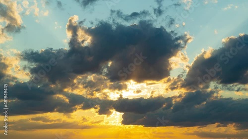 Clouds fly across the sky at sunset. Timelapse