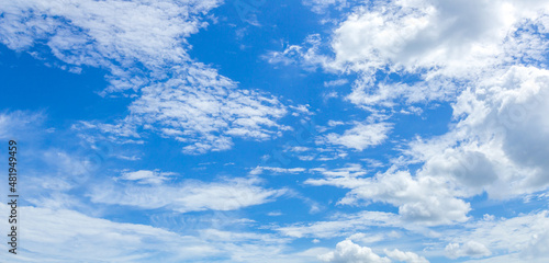 Panorama or panoramic photo of blue sky and white clouds or cloudscape.