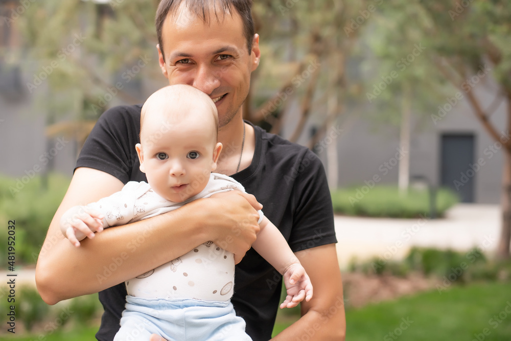 Fototapeta premium Summer portrait of beautiful baby on the lawn