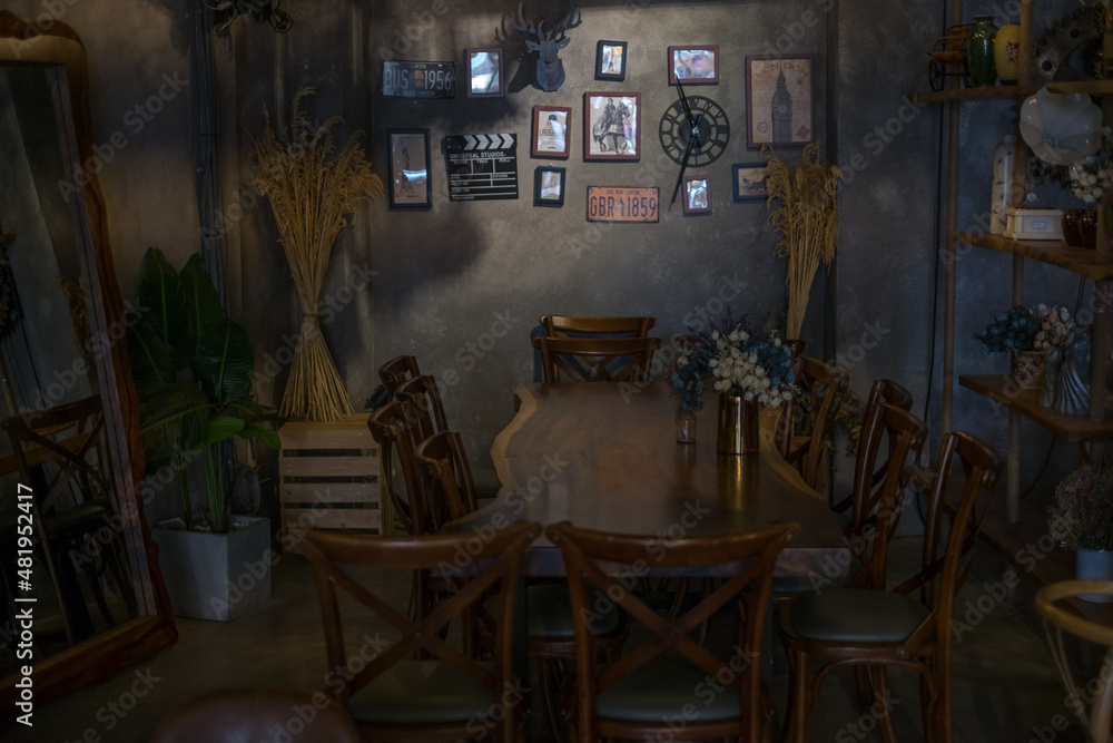 Eco cafe design in brown. Chandeliers made of rope. Antique items on the wall. Solid wood furniture. flower bouquets. High quality photo Eco cafe design in brown. Chandeliers made of rope. Antique items on the wall. Solid wood furniture. flower bouquets. High quality photo