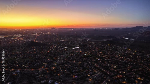 Twilight Hyperlapse Aerial of Arizona Desert Neighborhoods with Small Mountains