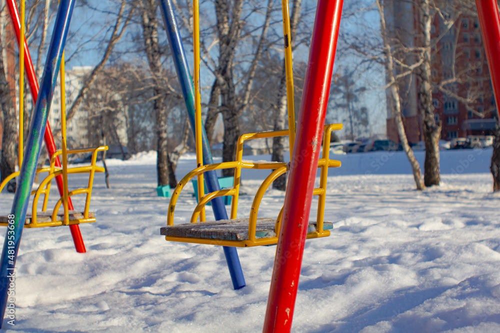 Swing on winter background.